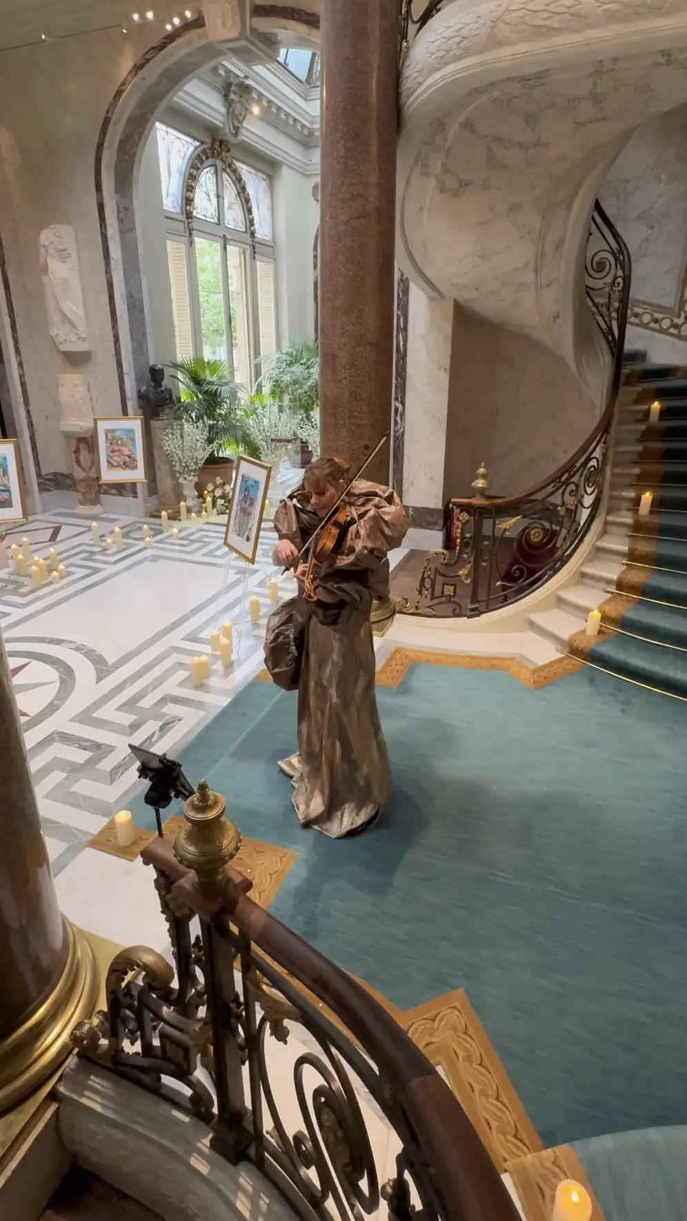 Violinist rehearsing on staircase landing before a proposal at Musée Jacquemart-André