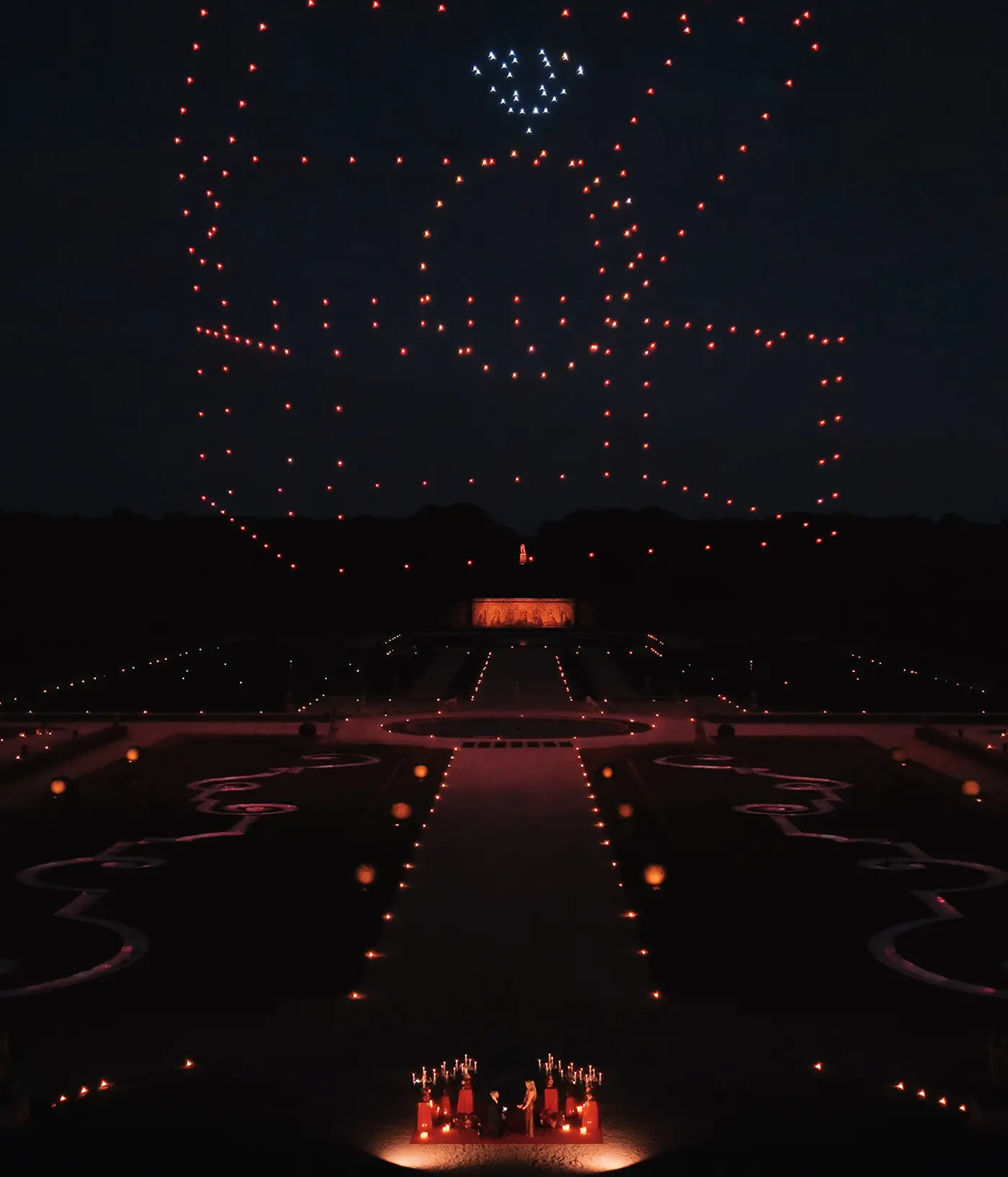 Drone show forming an engagement ring box above Château de Vaux-le-Vicomte during a private proposal.