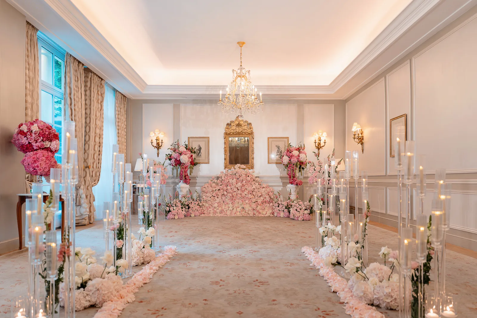 Rambouillet Salon at Le Bristol Paris prepared for a private proposal with a candlelit aisle, pink floral installation, and live music setting.