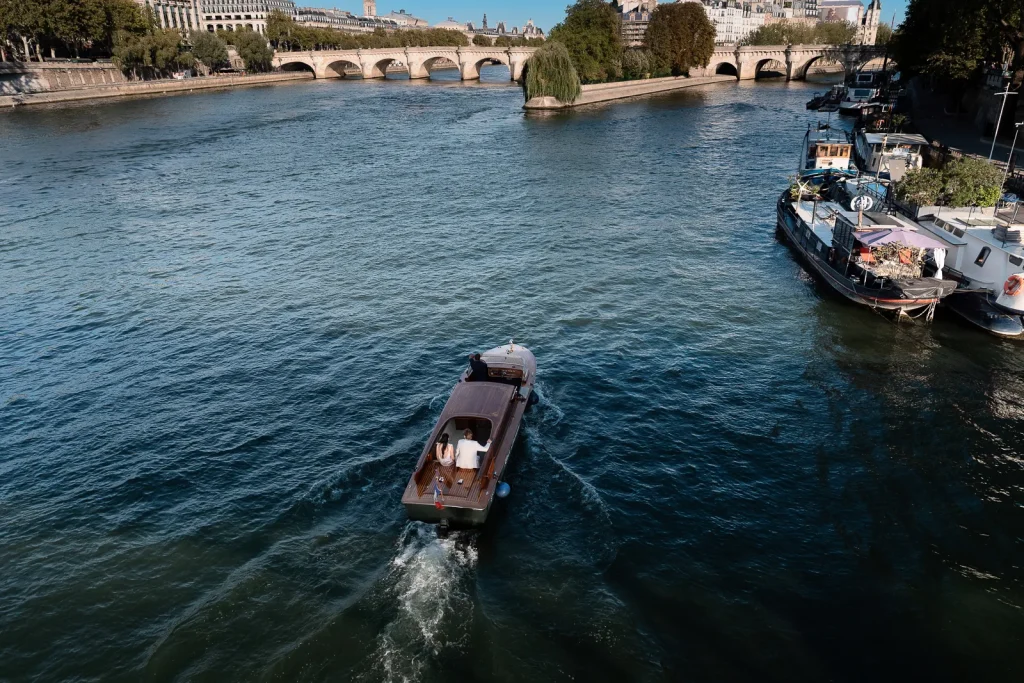 Private boat cruising along the Seine before a surprise marriage proposal at Le Bristol Paris.