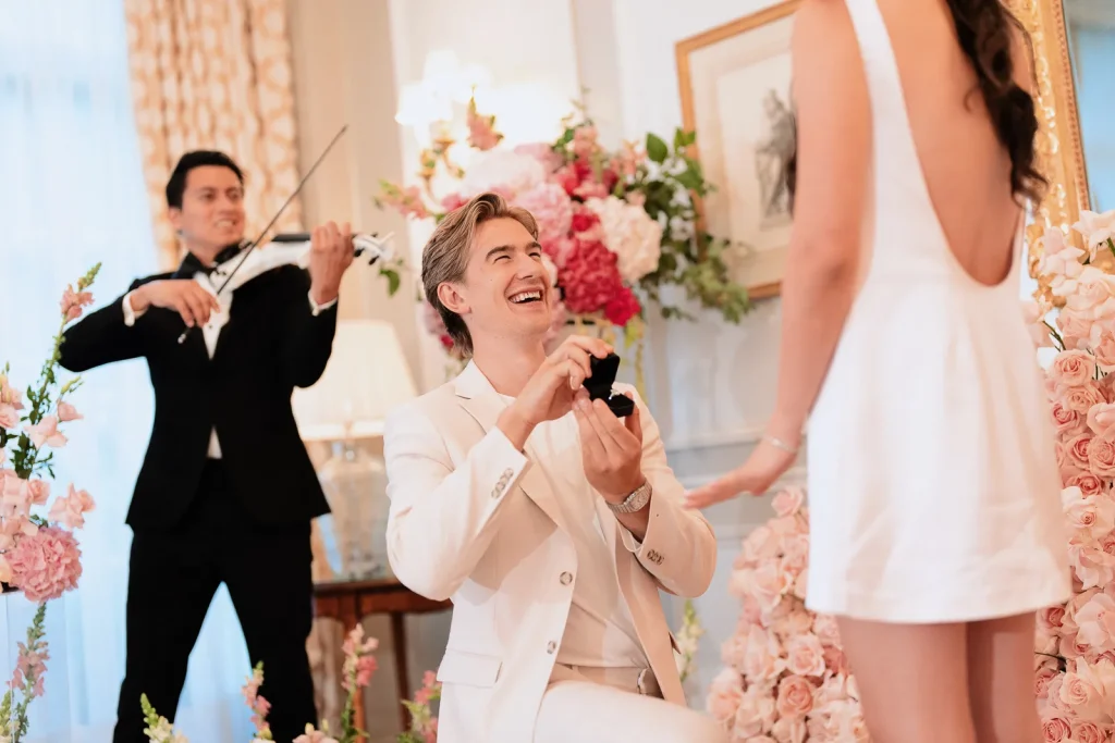 Marriage proposal at Le Bristol Paris with a violinist performing as Ryan proposed to Alexie inside the Rambouillet Salon.
