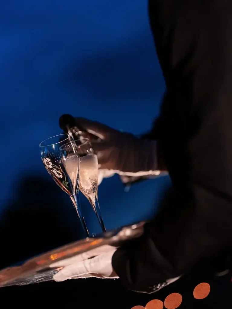 Champagne glasses prepared for a nighttime proposal at Château de Vaux-le-Vicomte near Paris