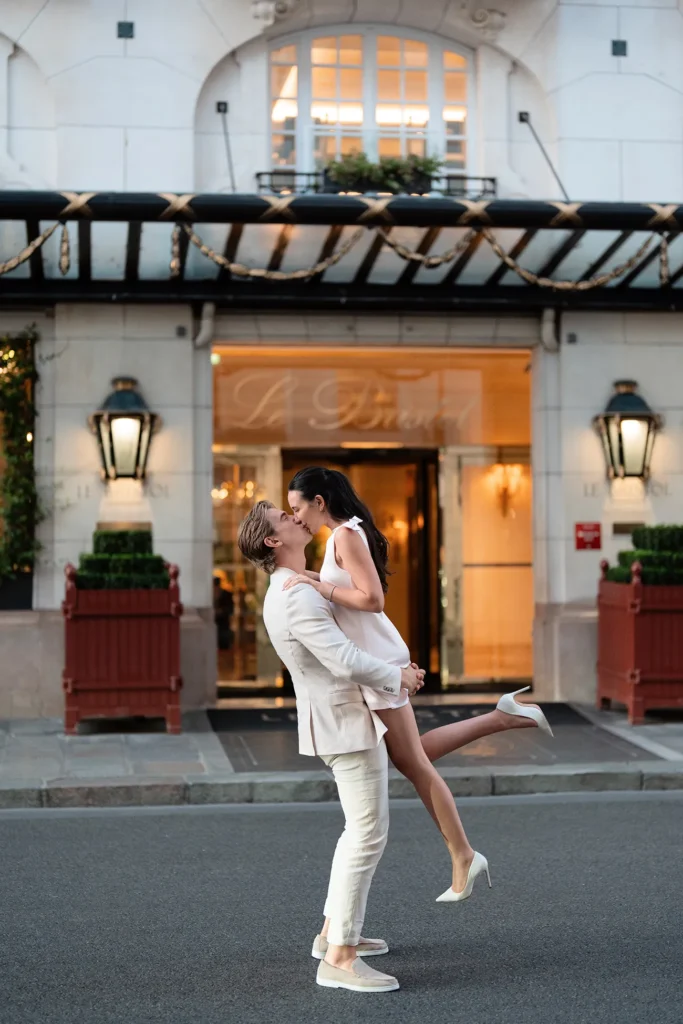 Couple kissing outside Le Bristol Paris after their private proposal