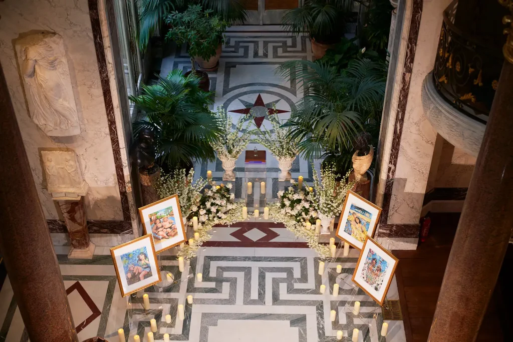 Proposal decor at Musée Jacquemart André Paris, candlelit aisle with floral urns and ring display