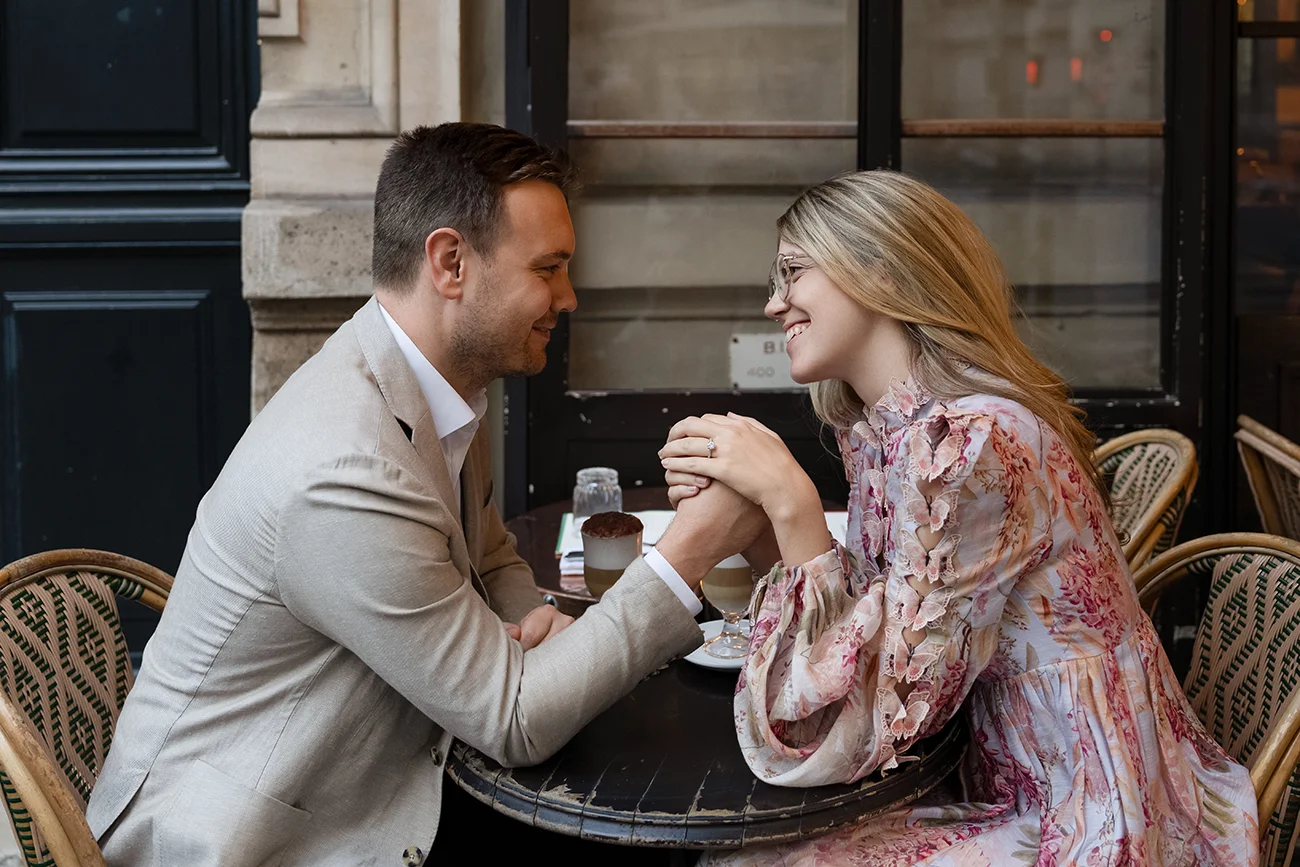 Couple having dinner at a Paris brasserie as a believable proposal cover story