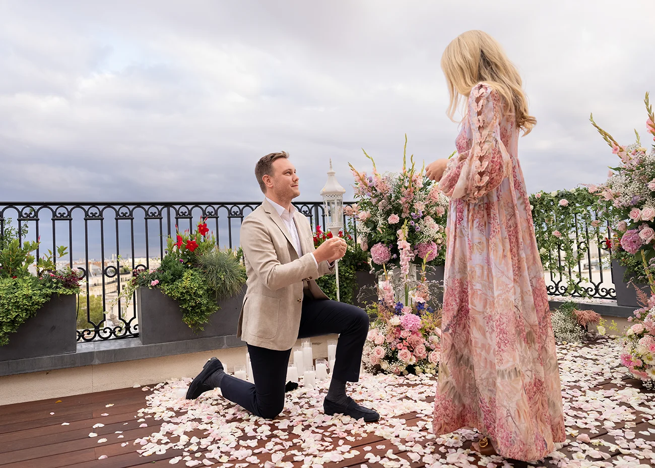 Man kneeling on one knee as he proposes to his partner